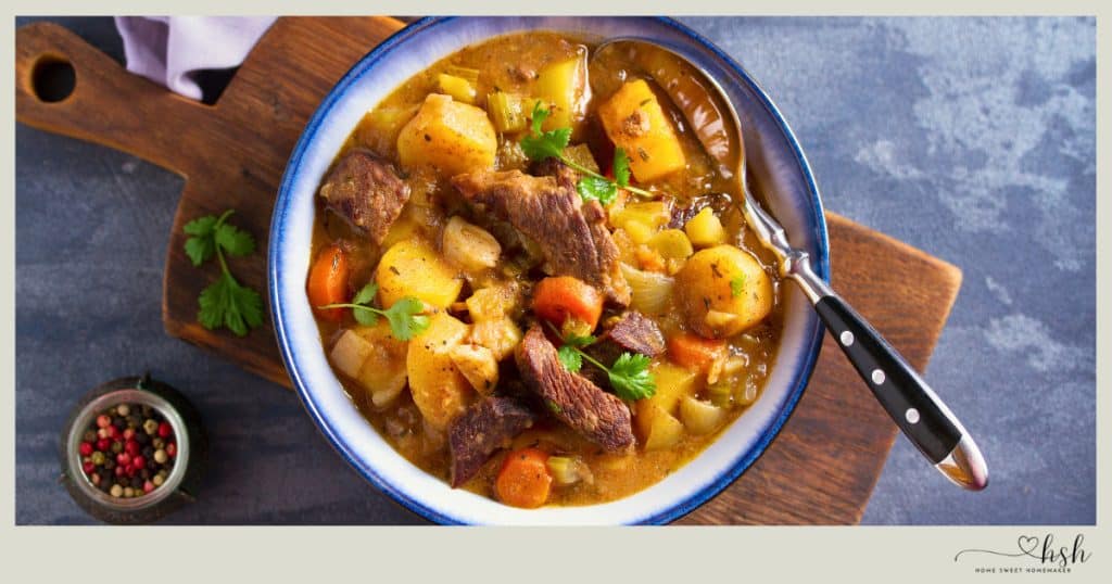A bowl of thick beef stew with potatoes and carrots, a comforting example of easy January slow cooker recipes.