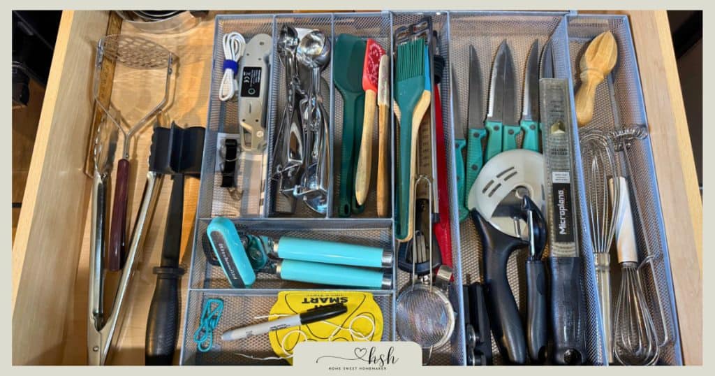 How to Organize a Small Kitchen on a Budget | Complete Guide 6 Kitchen drawer with mesh divider inserts organizing utensils, knives, spatulas, measuring tools, and cooking gadgets in separated compartments for maximum efficiency.