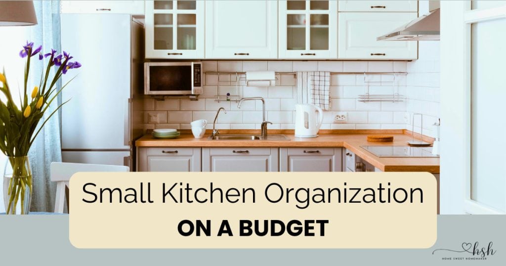 How to Organize a Small Kitchen on a Budget | Complete Guide 1 Bright, organized small kitchen with white cabinets and wooden countertops showing how to organize a small kitchen on a budget using simple, clutter-free storage solutions