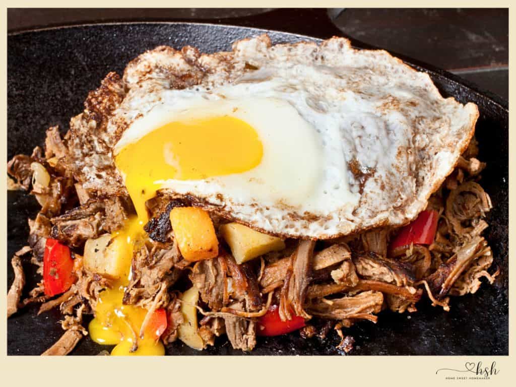 Leftover Beef Brisket Recipes That Turn Yesterday’s Dinner Into Something New 3 Leftover beef brisket hash topped with sunny side up egg and roasted peppers and potatoes
