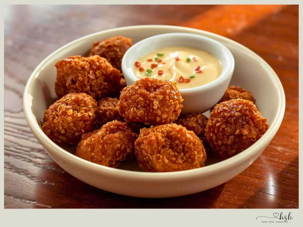 Leftover Beef Brisket Recipes That Turn Yesterday’s Dinner Into Something New 9 Golden fried leftover beef brisket nuggets served with creamy dipping sauce in white bowl