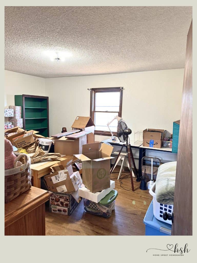 Your Complete Post-Holiday Home Reset Guide 3 A cluttered room filled with cardboard boxes and packing materials during a messy but necessary post-holiday home reset.