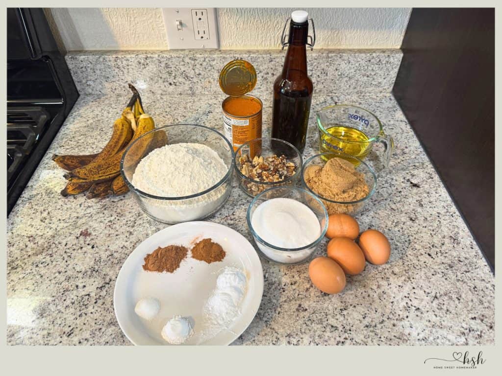 Organized pumpkin banana bread baking ingredients with overripe bananas and pumpkin puree on countertop